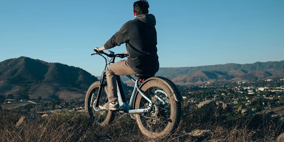 A man riding a bike on a hill