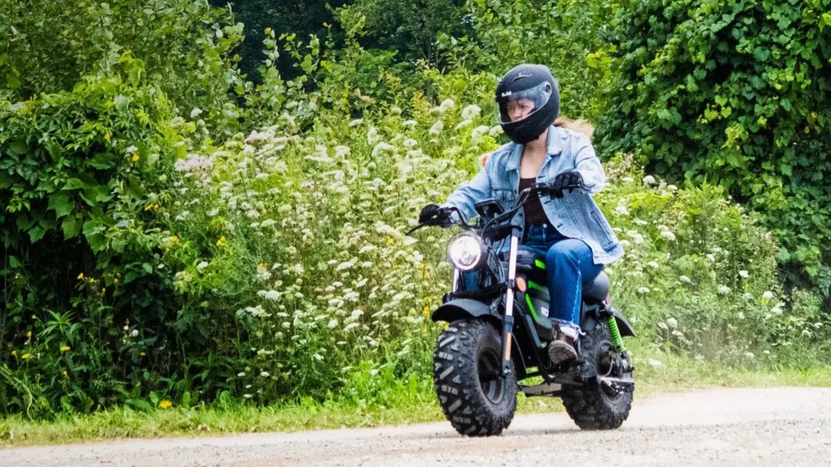 A woman riding a motorcycle