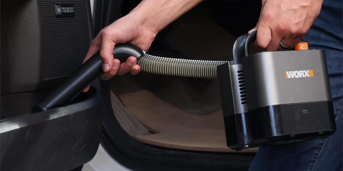 A person holding a vacuum cleaner