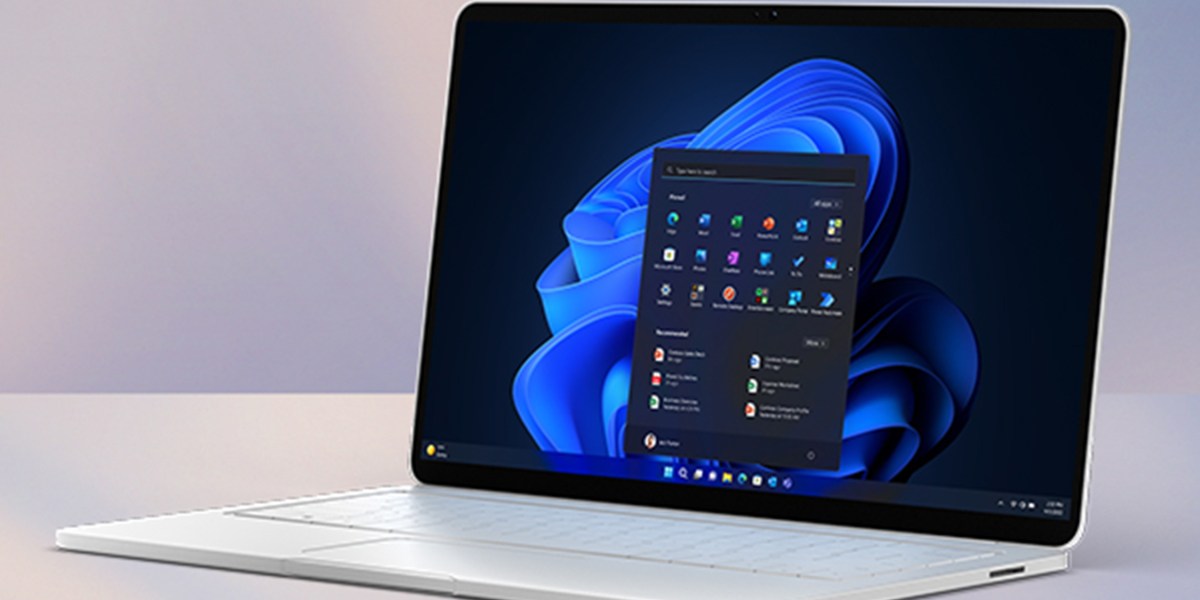 A laptop with a blue flower on the screen